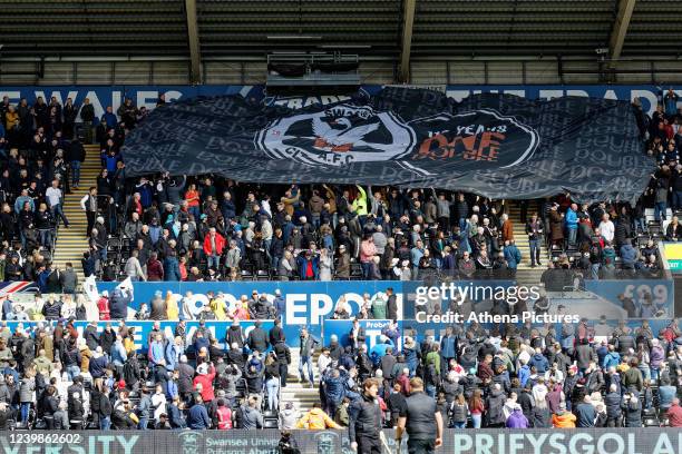 Giant banner celebrating the first ever double win against Cardiff City in 110 years is being moved by Swansea supporters in the east stand prior to...