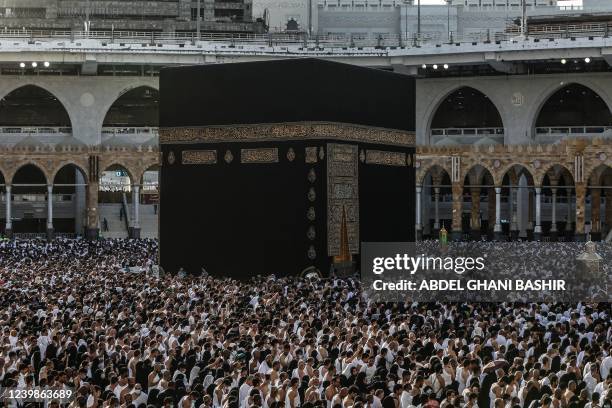 Muslims pray around the Kaaba, Islam's holiest shrine, at the Grand Mosque complex in the Saudi city of Mecca, during the fasting month of Ramadan,...