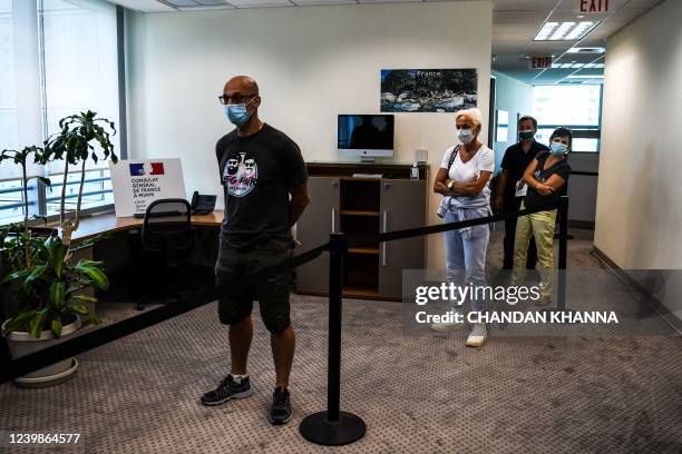 French citizens wait in line to cast their vote during the Presidential elections vote at the French Consulate in Miami, Florida, on April 09, 2022.