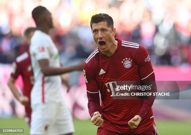 Bayern Munich's Polish forward Robert Lewandowski celebrates after scoring a penalty during the German first division Bundesliga football match FC...