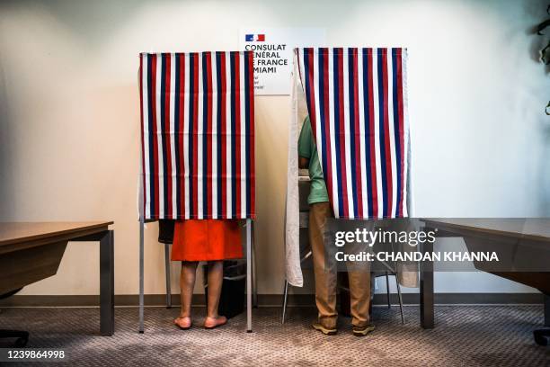 French citizens cast their vote during the Presidential elections vote at the French Consulate in Miami, Florida, on April 09, 2022.