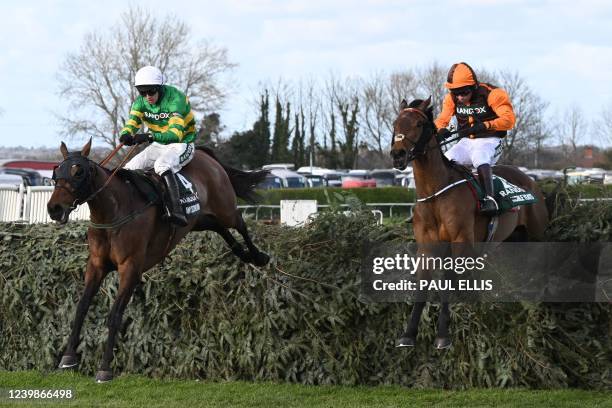 Eventual winner Noble Yeats ridden by jockey Sam Waley-Cohen and runner-up Any Second Now ridden by jockey Mark Walsh jump the final fence in the...