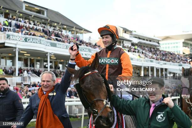 First-placed Noble Yeats riden by jockey Sam Waley-Cohen celebrates with owner Robert Waley-Cohen winning the Grand National Steeple Chase on the...