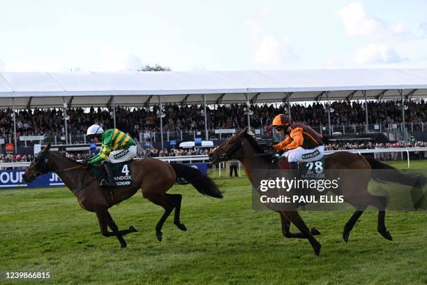 Eventual winner Noble Yeats ridden by jockey Sam Waley-Cohen and runner-up Any Second Now ridden by jockey Mark Walsh compete in the Grand National...