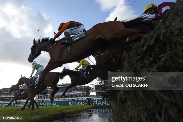 Eventual winner Noble Yeats ridden by jockey Sam Waley-Cohen take the water-jump during the Grand National Steeple Chase on the final day of the...