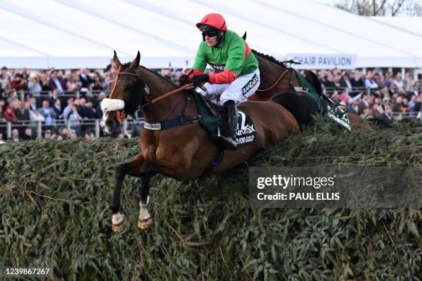 Two for Gold ridden by jockey David Bass jumps The Chair in the Grand National Steeple Chase on the final day of the Grand National Festival horse...