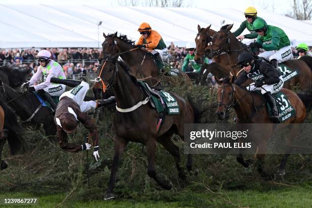 Jockey Harry Bannister falls from Domaine De L'Isle as they jump the The Chair fence in the Grand National Steeple Chase on the final day of the...