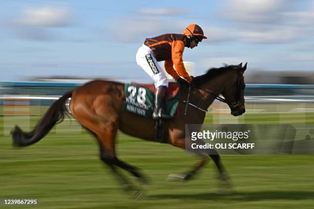 Eventual winner Noble Yeats ridden by jockey Sam Waley-Cohen rides to the start line ahead of the Grand National Steeple Chase on the final day of...