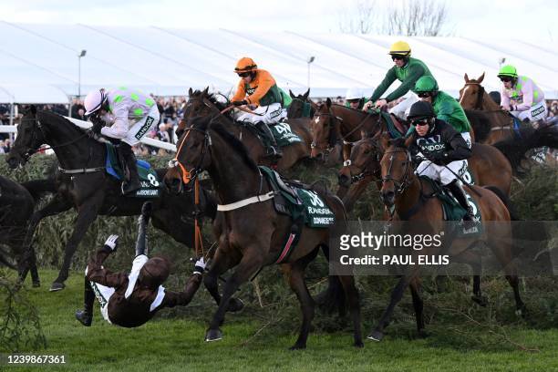 Jockey Harry Bannister falls from Domaine De L'Isle as they jump the The Chair fence in the Grand National Steeple Chase on the final day of the...