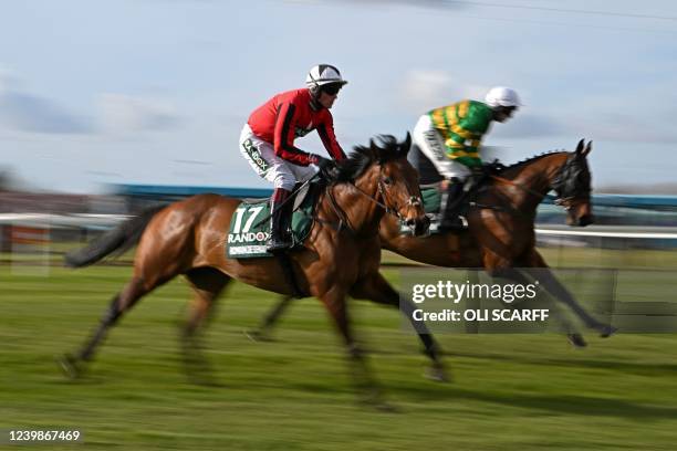 Second placed finisher Any Second Now riden by jockey Mark Walsh and Romain De Senam ridden by jockey Phillip Armson ride to the start line ahead of...