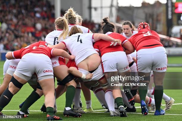 Players compete for the ball in the maul during the Six Nations international women's rugby union match between England and Wales at Kingsholm...