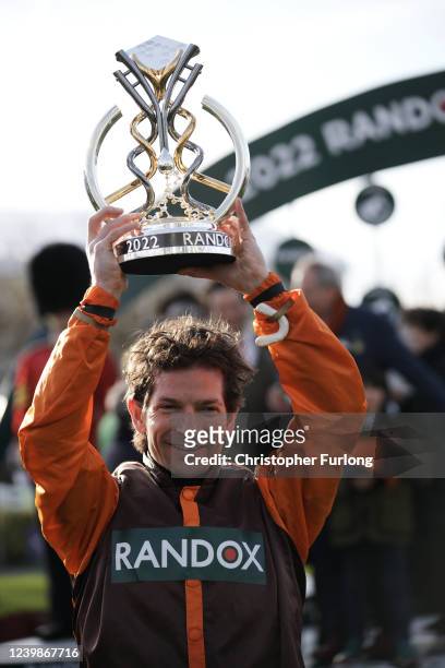 Winning jockey Sam Waley-Cohen celebrates with the Grand National Trophy after riding Noble Yeats to victory in the Grand National Steeplechase at...