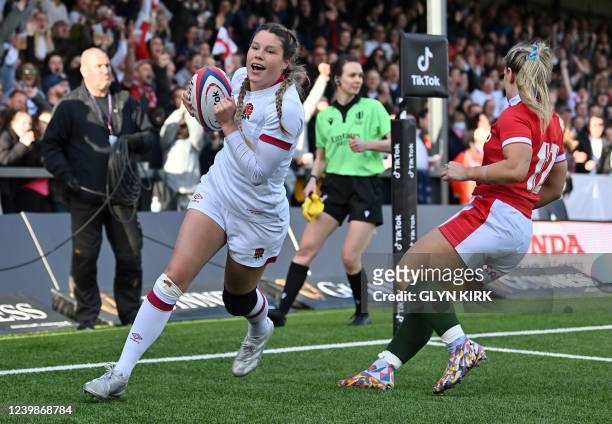 England's wing Jess Breach celebrates scoring a try during the Six Nations international women's rugby union match between England and Wales at...