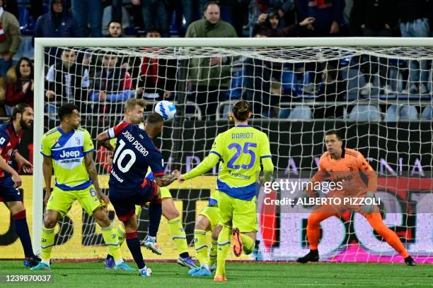 Cagliari's Brazilian midfielder Joao Pedro Galvao heads to score his team's first goal during the Italian Serie A football match between Cagliari and...