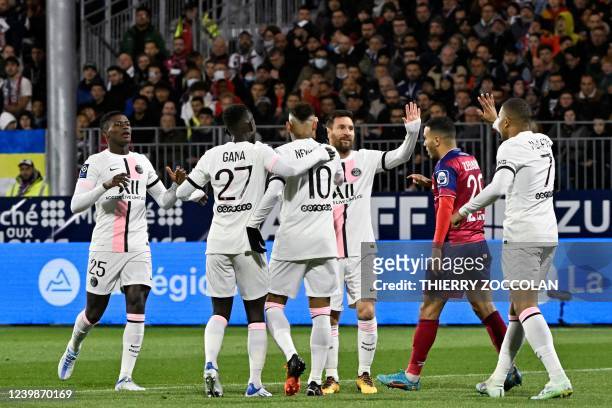 Paris Saint-Germain's Brazilian forward Neymar celebrates with teammates after scoring during the French L1 football match between Clermont Foot 63...