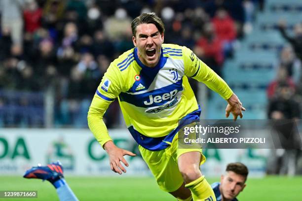 Juventus' Serbian forward Dusan Vlahovic celebrates after scoring his team's second goal during the Italian Serie A football match between Cagliari...