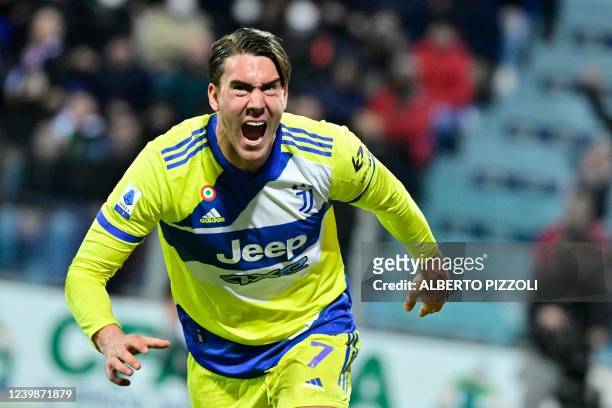 Juventus' Serbian forward Dusan Vlahovic celebrates after scoring his team's second goal during the Italian Serie A football match between Cagliari...