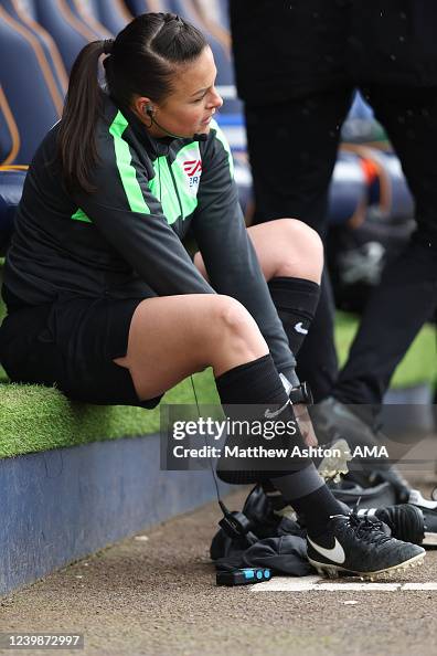 Lisa Scullen Rashid Assistant Referee Lisa Rashid changes her boots before coming on as a ...