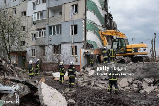 Rescue workers clear the rubble of an apartment building on April 9, 2022 in Borodianka, Ukraine. The Russian retreat from towns near Kyiv has...