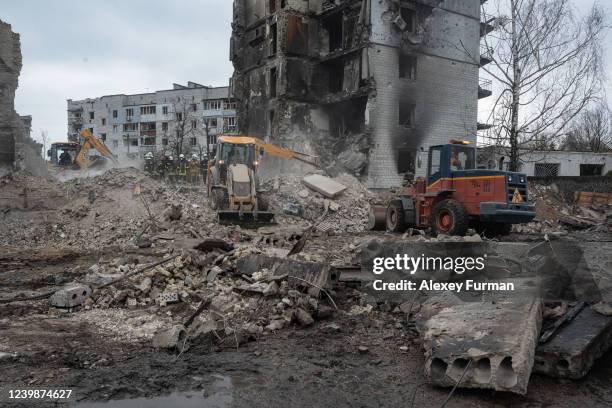 Rescue workers clear the rubble of an apartment building on April 9, 2022 in Borodianka, Ukraine. The Russian retreat from towns near Kyiv has...