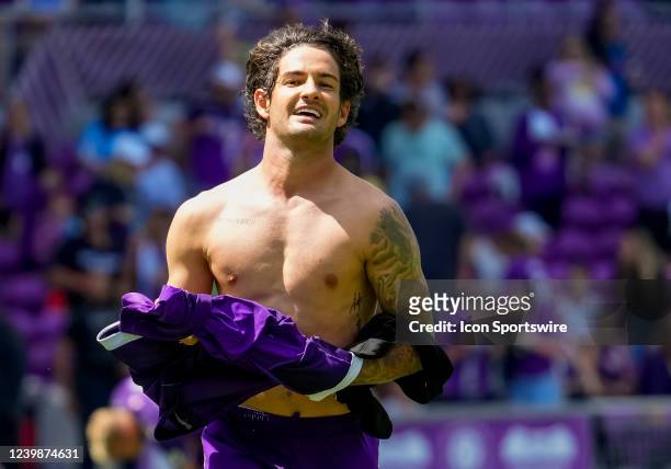 Orlando City forward Alexandre Pato removes his shirt to give to a fan dat the end of the MLS soccer match between the Orlando City SC and Chicago...