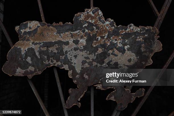 Burnt map of Ukraine is seen in the window of a burnt building April 9, 2022 in Borodianka, Ukraine. The Russian retreat from towns near Kyiv has...