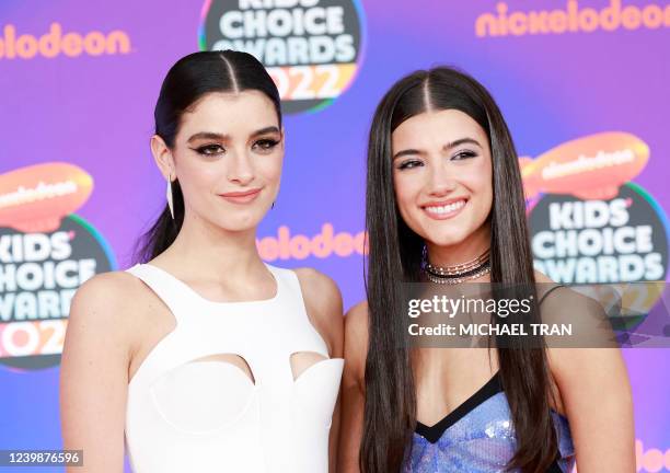 Social media personalities Dixie D'Amelio and Charli D'Amelio attend the 2022 Nickelodeon Kids' Choice Awards held at Barker Hangar in Santa Monica,...