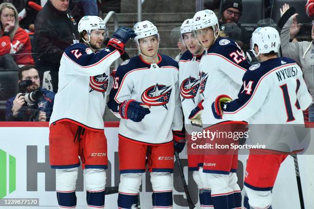 Players celebrate the first period goal by Columbus Blue Jackets Center Jack Roslovic during the game between Columbus Blue Jackets and Detroit Red...