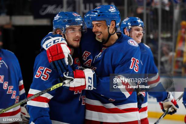 Ryan Reaves and Ryan Lindgren of the New York Rangers celebrate after a 5-1 win against the Ottawa Senators at Madison Square Garden on April 9, 2022...