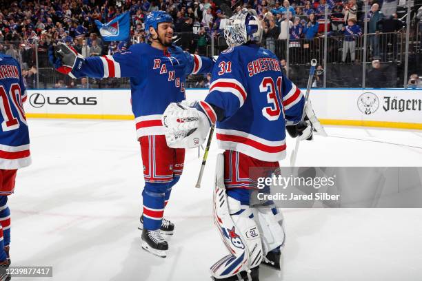 Igor Shesterkin and Ryan Reaves of the New York Rangers celebrate after a 5-1 win against the Ottawa Senators at Madison Square Garden on April 9,...