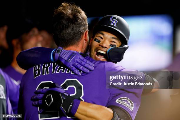 Connor Joe of the Colorado Rockies celebrates his go-ahead solo home run with Kris Bryant in the eighth inning against the Los Angeles Dodgers at...