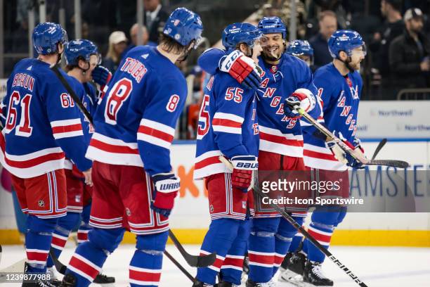 The New York Rangers celebrate clinching a playoff berth for the first time in five years in the National Hockey League game between the Ottawa...