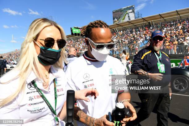 Mercedes' British driver Lewis Hamilton arrives for the drivers parade ahead of the 2022 Formula One Australian Grand Prix at the Albert Park Circuit...
