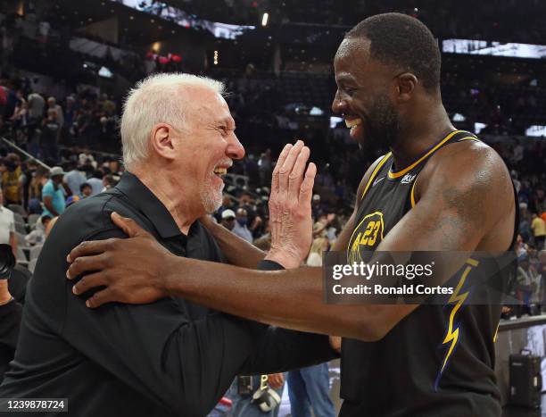 Draymond Green of the Golden State Warriors greets San Antonio head coach Gregg Popovich at the end of the game at AT&T Center on April 9, 2022 in...