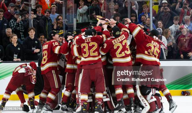 The Denver Pioneers celebrates with the NCAA championship trophy after they captured the NCAA title against the Minnesota State Mavericks 5-1 during...