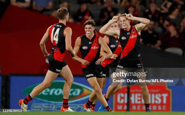 Mason Redman of the Bombers celebrates a goal during the 2022 AFL Round 04 match between the Essendon Bombers and the Adelaide Crows at Marvel...