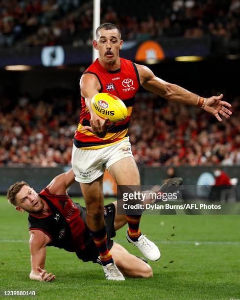 Taylor Walker of the Crows marks the ball ahead of Jayden Laverde of the Bombers during the 2022 AFL Round 04 match between the Essendon Bombers and...