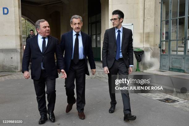 Former French President Nicolas Sarkozy arrives with Mayor of Paris' 16th arrondissement Francis Szpiner to cast his ballot for the first round of...