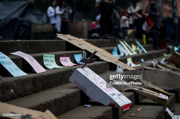 Sign with a carboard coffin that reads 'No more victims Mayor Claudia Lopez' as Embera indigenous communities that camp at Bogota's National Park...