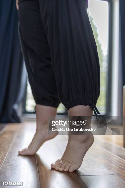 In this photo illustration a woman practise foot gymnastic on April 08, 2022 in Bonn, Germany.