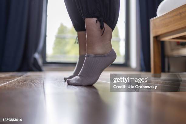 In this photo illustration a woman practise foot gymnastic on April 08, 2022 in Bonn, Germany.