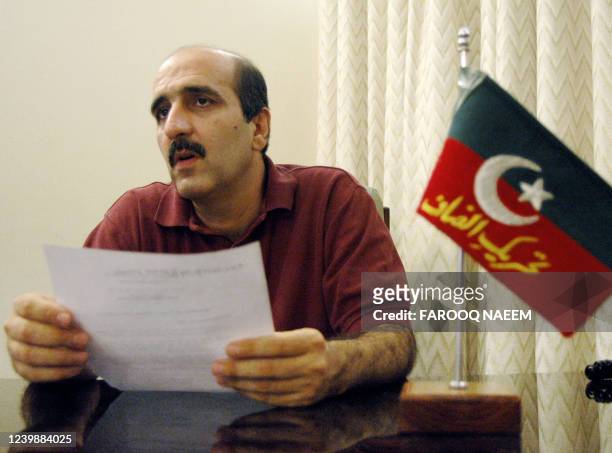 Central Information Secretary of Pakistan's Tehreek-i- Insaaf political party Akbar Babar reads a statment announcing the divorce of party chief...
