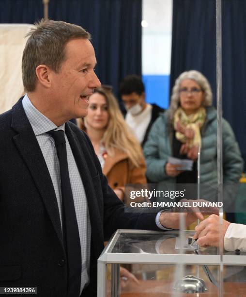 French far-right party Debout La France presidential candidate Nicolas Dupont-Aignan casts his ballot for the first round of France's presidential...