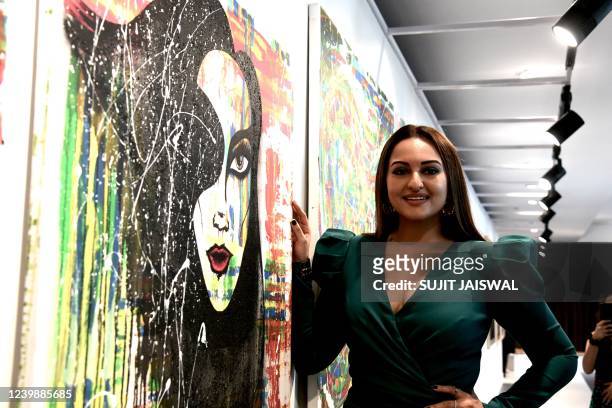 Bollywood actress Sonakshi Sinha displays her artwork during her first exibition at the House of Creativity in Mumbai on April 10, 2022.