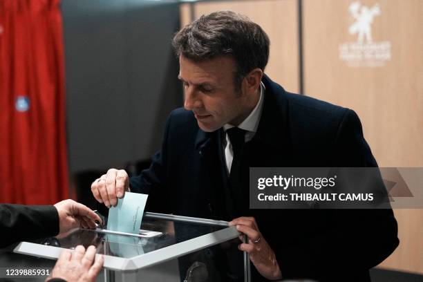 France's President and LREM party presidential candidate Emmanuel Macron casts his ballot for the first round of France's presidential election at a...