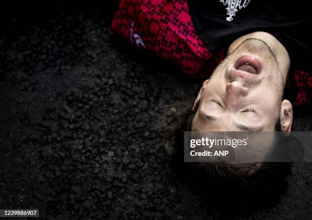 Runner crosses the finish line exhausted during the 41st edition of the NN Marathon Rotterdam on April 10, 2022 in Rotterdam, the Netherlands. KOEN...