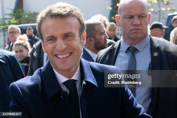 Emmanuel Macron, France's president, greets members of the public after voting at a polling station during the first round of the French presidential...