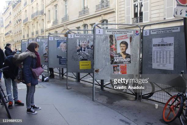 View of torn election posters for the 2022 French presidential election outside polling station, Roquepine Gymnasium as France goes to the polls in...