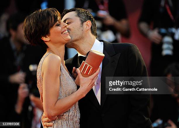 Actress Claudia Pandolfi and actor Filippo Timi attend the "Quando La Notte" premiere during the 68th Venice Film Festival at Palazzo del Cinema on...