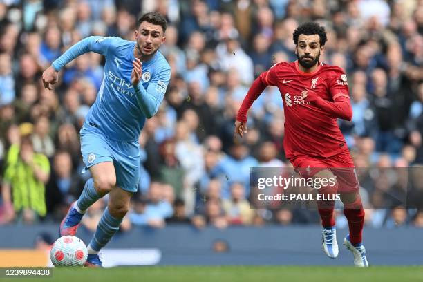 Liverpool's Egyptian midfielder Mohamed Salah vies with Manchester City's French defender Aymeric Laporte during the English Premier League football...